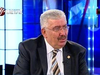 MHP'den Kaplan'a: Kafandaki örtü Tük bayrağı ile aynı