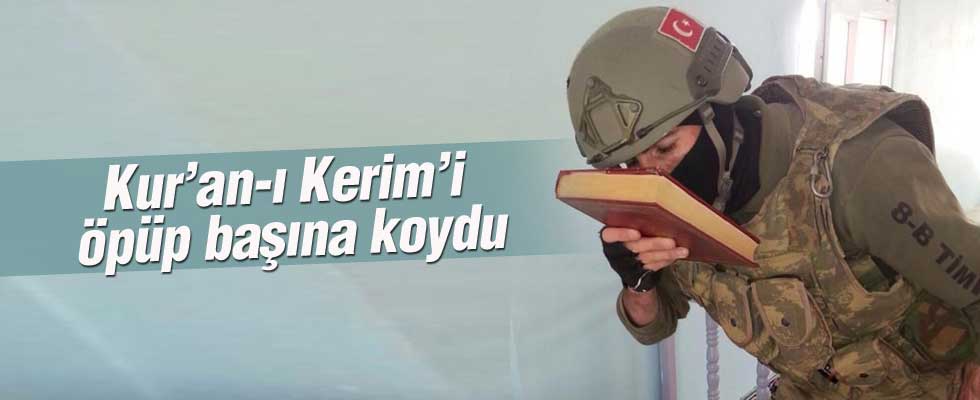 Kur'an-ı Kerim'i öpüp, başına koydu