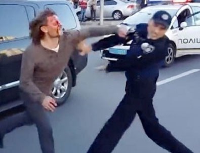Ukraynalı eski güreşçiyi yedi polis tutamadı