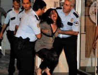 Cinnet getiren kadın ev eşyalarını sokağa fırlattı
