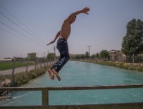 SU KANALI - Şanlıurfa'da sıcak hava bunaltıyor