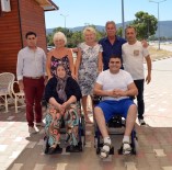 SOSYAL HAYAT - Didim'de Yabancılar İki Engelliye Akülü Sandalye Bağışladı