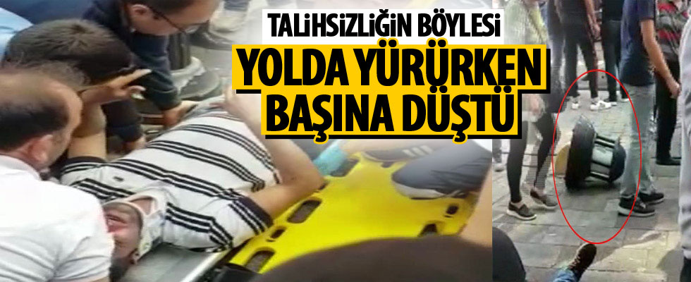 Yolda yürüyen adamın başına...