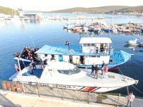 İzmir'de Yurt Dışına Geçmeye Çalışan Tekneye Baskın Açıklaması Çok Sayıda Kişi Yakalandı Haberi