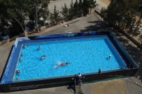 Antalya'da Okul Bahçesine Portatif Yüzme Havuzu Haberi
