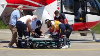 AMBULANS HELİKOPTER - Kafasina Kamyonetin Arka Kapagi Düsen Kadin Ambulans Helikopterle Hastaneye Kaldirildi