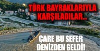 Türk bayraklarıyla karşılandı! İş makinelerini taşıyan Deniz Kuvvetleri Komutanlığı'na bağlı çıkarma gemisi Sinop'ta